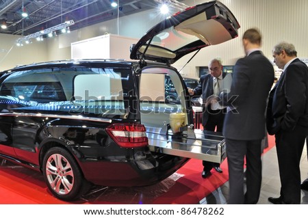 WARSAW - NOVEMBER 20: Presentation of the urn placed in a hearse at the exhibition of funeral industry 