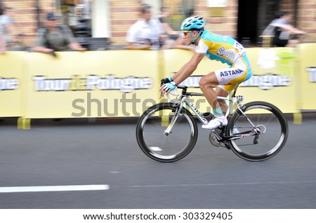 WARSAW, POLAND - AUGUST 1, 2010: Cyclist along the route of the cycling race \