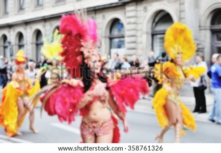 Blurred background of Samba dancers during carnival parade.