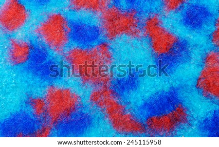 Multicolor mosaic fabric texture of wool with flower and  beads .  Craft background