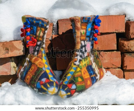 felted boots on the snow