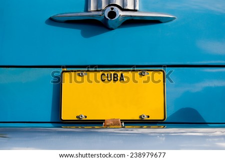 Yellow Cuban Plate on Blue Car