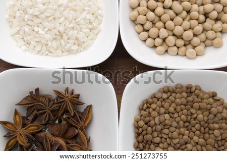 Spices, Lentils Rice and Died Peas in White Bowls