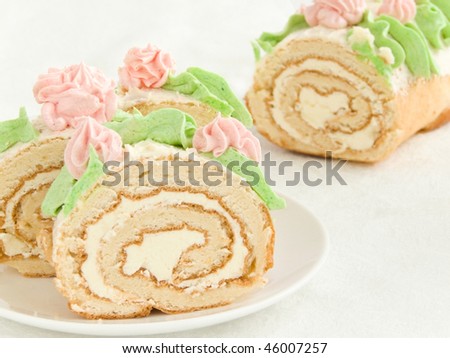 Plate with sweet homemade cream roll. Shallow dof.