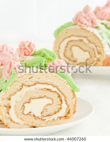 Plate with sweet homemade cream roll. Shallow dof.