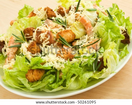 Plate with fresh caesar salad. Shallow dof.