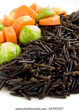 Wild rice with carrot and brussels sprouts. Shallow dof.