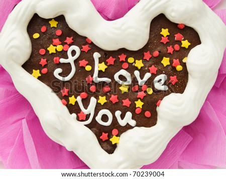 Heart-shaped chocolate cake for Valentine\'s Day. Viewed from above.