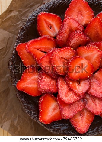 Homemade chocolate cake with strawberry. Viewed from above.