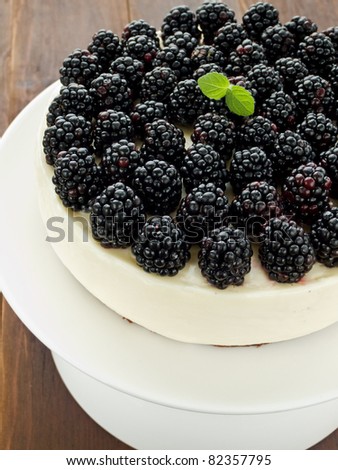 Sour cream cheesecake with blackberries. Viewed from above.