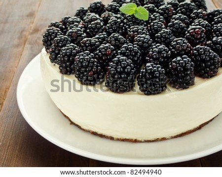 Sour cream cheesecake with blackberries. Shallow dof.