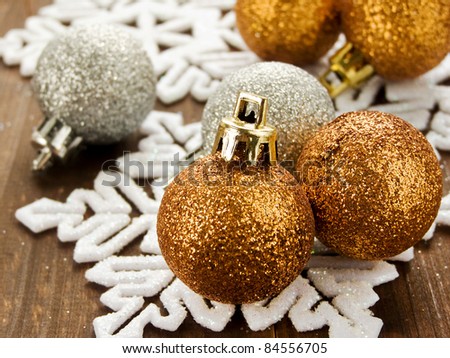 Christmas ornaments on the wooden background. Shallow dof.