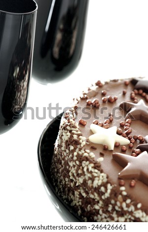 CHOCOLATE CAKE - A cropped image of a chocolate cake with chocolate stars