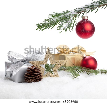 Christmas Gifts lying in snow under a christmas tree