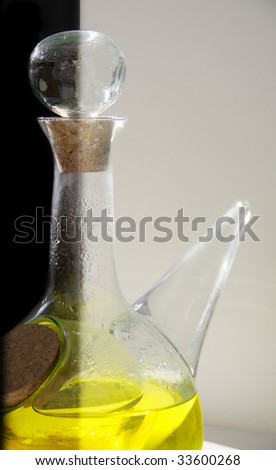 different bottle whit yellow liquid on white and black background