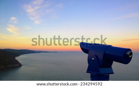 Telescope by the coast in Babbacome, Torquay, Devon