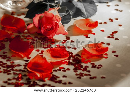 Roses, champagne, petal and heart shaped confeti, some effects used to remove certain colours from image and median noise reduction also used on some images to produce a faded look,