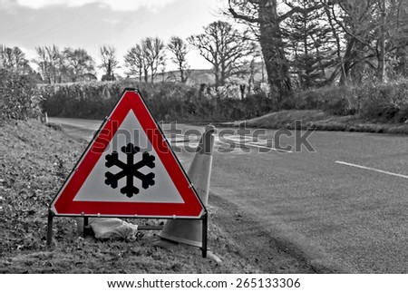 Illustration of a snow and ice sign shown on a road