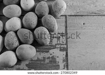 mini eggs laying on a wooden background