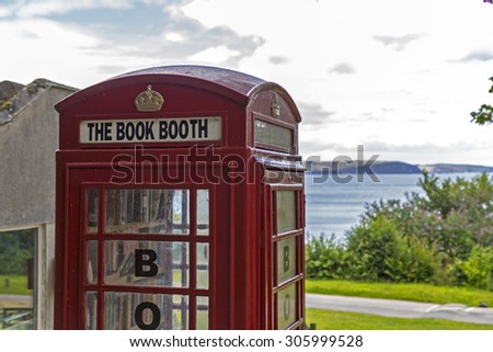 Showing a phone booth converted to a book share.