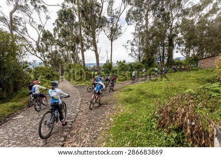 Group of mountain bikers on the roads of the Ecuadorian sierra