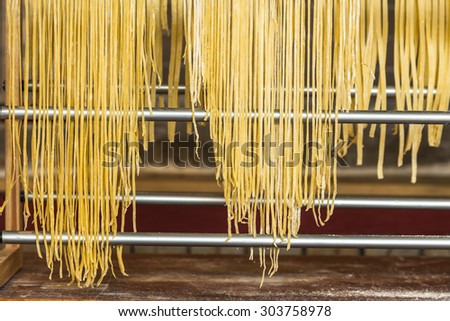 Homemade noodles drying on aluminum support