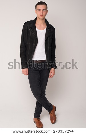 Fashionable  guy on a white background in  jacket