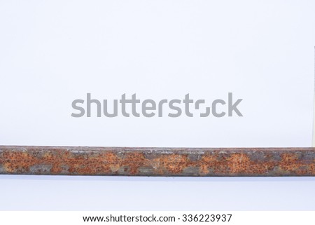 rust on a metal square pipe on the white background
