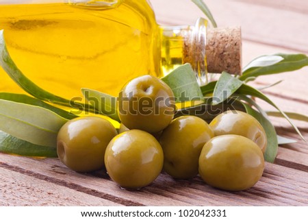 green olives with oil and leaves