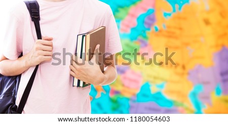 student hand with books and map, learn languages