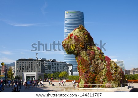 Bilbao, Spain - September 22: Guggenheim Museum And Puppy Sculpture On September 22, 2012 In Bilbao, Spain. The Museum Was Designed By Frank Ghery And The Puppy Sculpture By Jeff Koons