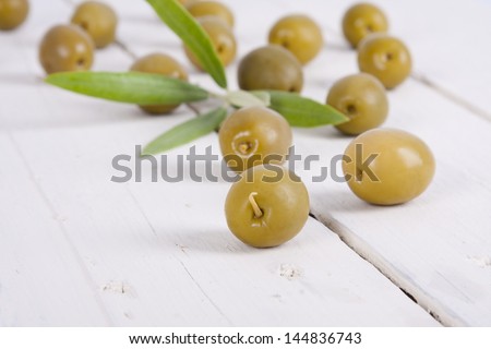 olives on wooden background white backgrounds food