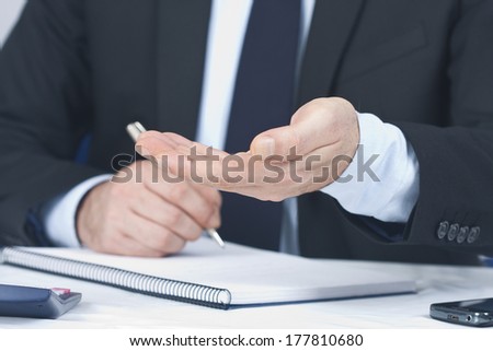 Businessman working in the office in the foreground