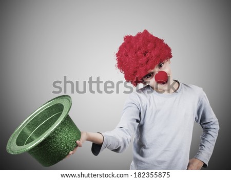boy with clown nose and hat on background