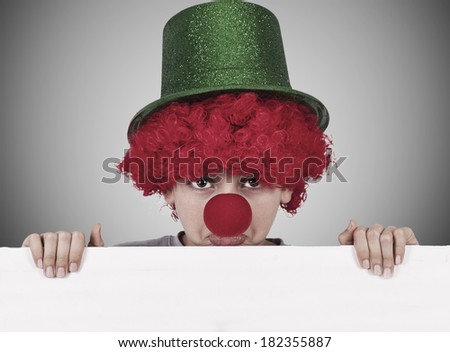boy with clown nose and hat on background