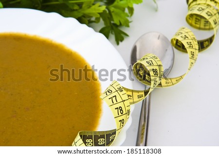 tape measure with healthy food to lose weight