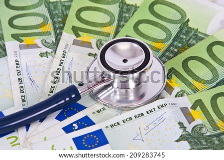 euro banknotes and coins with stethoscope, financial health