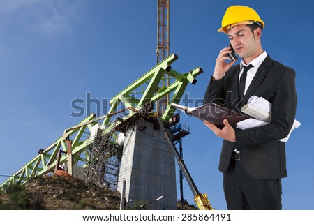 architect with plans and helmet work