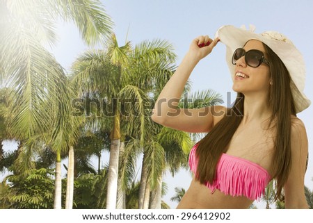 bikini girl in the summer with palm trees