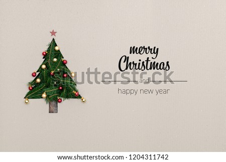Merry Christmas and happy new year greetings in vertical top view cardboard with natural eco decorated christmas tree pine.Ecology concept.Xmas winter holiday season social media card background