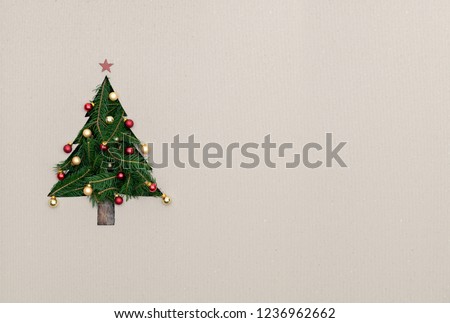 Text or logo empty copy space in vertical top view cardboard with natural eco decorated christmas tree pine.Xmas winter holiday season party social media card background