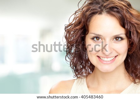 beautiful brunette girl smile portrait in a interior background