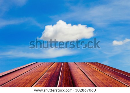 Wooden walking way into the Cloud and blue sky
