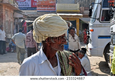 Nagaur, Rajasthan, India - October 16, 2013: Side profile of an old Indian man with white beard at daytime in the streets of Nagaur in Rajasthan, India