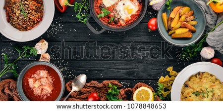Food. Set of dishes on the table. On a wooden background. Top view. Copy space.
