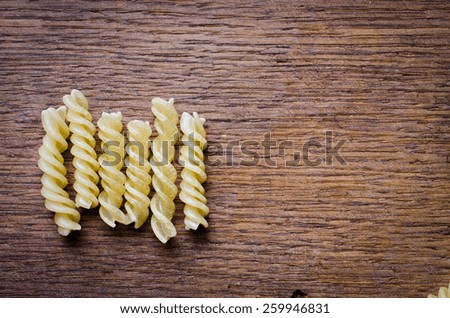 pasta lying on the oak board dark color