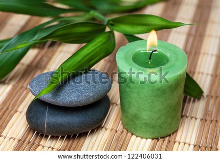 Bamboo, zen stones and candle in spa still life