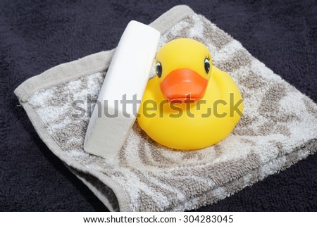 soap with a towel and a rubber ducky
