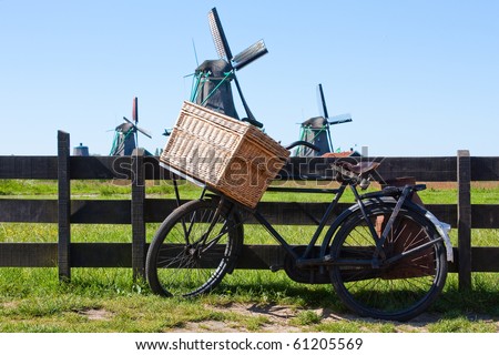 Clear and traditional landmark for Holland: bicycle and mills