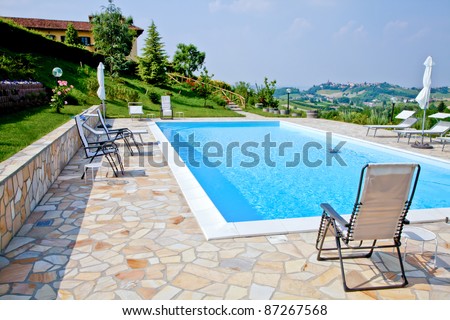 Swimming pool of an Italian beauty farm in the middle vineyards, Monferrato area, Piemonte region.